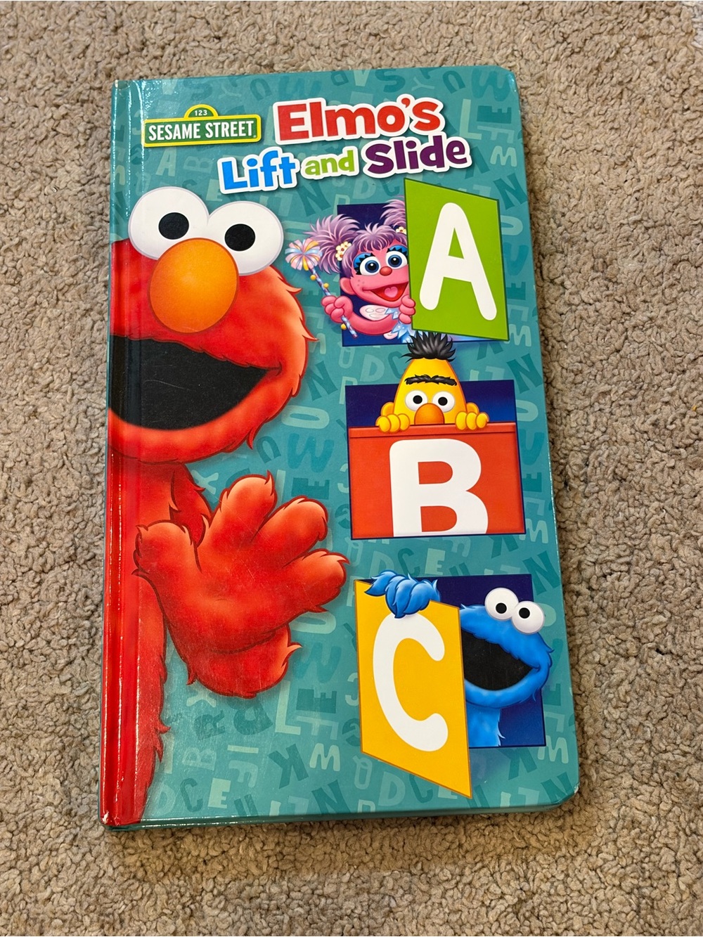 Sesame Street Elmo's Lift and Slide ABC Board Book -Hardcover